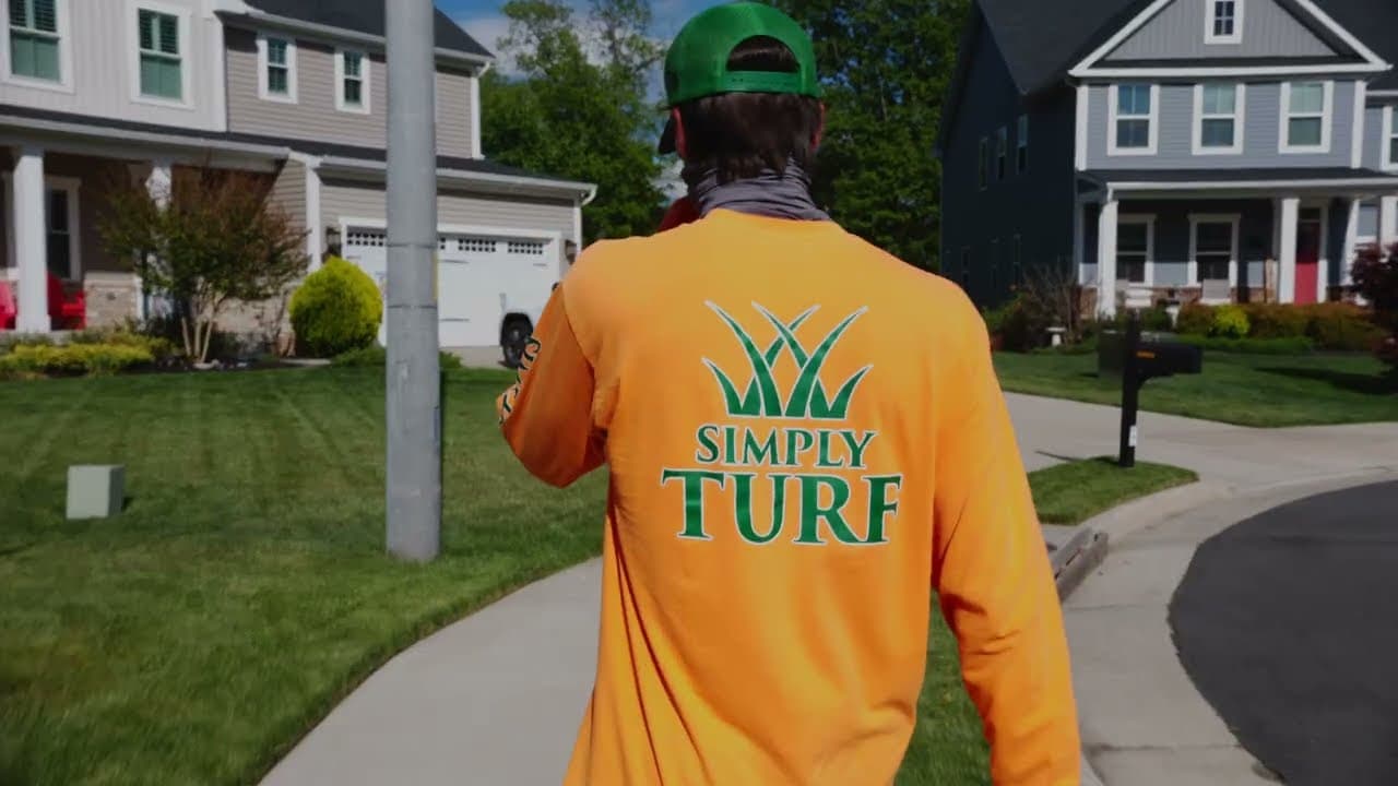 Simply Turf technician treating a Northern Virginia lawn
